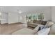 Bright living room with lots of natural light and open floor plan featuring new floors at 281 44Th Ave, St Pete Beach, FL 33706