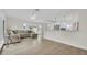 Bright and airy living room with open floorplan, featuring modern flooring and neutral tones at 281 44Th Ave, St Pete Beach, FL 33706