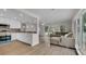Open concept living space with modern kitchen, stainless steel appliances, and bright living room at 281 44Th Ave, St Pete Beach, FL 33706