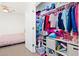 Bedroom and closet filled with colorful clothing and accessories at 2906 Boxwood Grove Row, Wesley Chapel, FL 33543