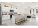 Gourmet kitchen featuring granite countertops, stainless steel appliances, and stylish island seating at 2906 Boxwood Grove Row, Wesley Chapel, FL 33543