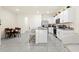 Modern kitchen with an island, stainless steel appliances, and a dining area, great for entertaining at 2906 Boxwood Grove Row, Wesley Chapel, FL 33543