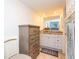 Bathroom featuring granite counters, a dresser, decor and tiled flooring at 29147 Bay Hollow Dr # 3217, Wesley Chapel, FL 33543