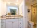 Bathroom featuring granite countertops, decorative knobs, and a walk-in shower at 29147 Bay Hollow Dr # 3217, Wesley Chapel, FL 33543