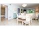 Bright dining area features a round table, seating for four, and opens to the bathroom and living area at 29147 Bay Hollow Dr # 3217, Wesley Chapel, FL 33543