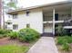 Exterior of a multi-Gathering property featuring lush landscaping, mature trees, and easy access at 29147 Bay Hollow Dr # 3217, Wesley Chapel, FL 33543