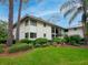 Exterior of a multi-Gathering property featuring lush landscaping and a view of green lawn at 29147 Bay Hollow Dr # 3217, Wesley Chapel, FL 33543