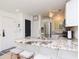 Stylish kitchen with white cabinets, stainless steel appliances, and a granite countertop island at 29147 Bay Hollow Dr # 3217, Wesley Chapel, FL 33543