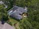 Aerial view of a large home featuring a screened pool and well-manicured landscaping at 2963 Cielo N Cir, Clearwater, FL 33759