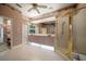 Bathroom features large mirror, updated vanity, glass enclosed shower, and tile floor at 2963 Cielo N Cir, Clearwater, FL 33759
