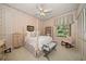 Charming bedroom featuring a four-poster bed, soft lighting, and serene decor at 2963 Cielo N Cir, Clearwater, FL 33759