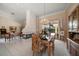 Open-concept dining room featuring fireplace and views of the pool and living room at 2963 Cielo N Cir, Clearwater, FL 33759