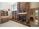 Close-up of a brick fireplace with decorative accents and built-in shelving at 2963 Cielo N Cir, Clearwater, FL 33759
