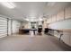 Finished garage space with game table, chairs, and storage cabinets at 2963 Cielo N Cir, Clearwater, FL 33759