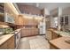 Spacious kitchen with light wood cabinets, tile countertops, and modern appliances at 2963 Cielo N Cir, Clearwater, FL 33759