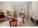 Inviting living room with fireplace and pool view; adorned with classic furniture and refined decor at 2963 Cielo N Cir, Clearwater, FL 33759