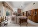 Bright living room featuring a brick fireplace, neutral furniture, and large windows with custom window treatments at 2963 Cielo N Cir, Clearwater, FL 33759