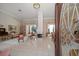 Elegant living room showcasing fireplace, dining area, and refined decor through doorway at 2963 Cielo N Cir, Clearwater, FL 33759