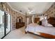 Spacious main bedroom with traditional furnishings and floral wallpaper accents at 2963 Cielo N Cir, Clearwater, FL 33759