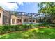 Inviting screened-in pool area with lush landscaping providing privacy and shade at 2963 Cielo N Cir, Clearwater, FL 33759