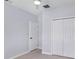 Simple bedroom features a ceiling fan and a double-door closet at 3016 N 73Rd St, Tampa, FL 33619