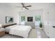 Serene bedroom featuring neutral tones, ample natural light, and modern furnishings at 3016 N 73Rd St, Tampa, FL 33619
