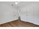 Well-lit bedroom with luxury vinyl plank flooring, ceiling fan, and access to other rooms at 3151 6Th S Ave, St Petersburg, FL 33712