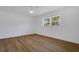 Cozy bedroom with a ceiling fan and a large window providing natural light at 3151 6Th S Ave, St Petersburg, FL 33712