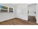 Well-lit bedroom with a large window, closet, and wood floors providing ample natural light at 3151 6Th S Ave, St Petersburg, FL 33712