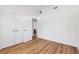 Bright room featuring hardwood floors, white walls, closet doors and a view to the bathroom at 3151 6Th S Ave, St Petersburg, FL 33712