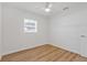 Bedroom featuring white walls, wood-look floors, and one window at 3151 6Th S Ave, St Petersburg, FL 33712