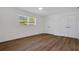 Bright bedroom features clean white walls, two closets, a ceiling fan, and luxury vinyl plank flooring at 3151 6Th S Ave, St Petersburg, FL 33712