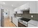Modern kitchen featuring stainless steel appliances, sleek cabinets, and stylish backsplash at 3151 6Th S Ave, St Petersburg, FL 33712