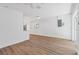 Spacious living room with white walls, wood-look floors, and sliding glass doors at 3151 6Th S Ave, St Petersburg, FL 33712