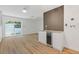 Open living space with wood floors and a bar area with a beverage cooler under a butcher block top at 3151 6Th S Ave, St Petersburg, FL 33712