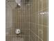 Close-up of shower with rainfall shower head and tile surround at 3151 6Th S Ave, St Petersburg, FL 33712
