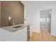 Close-up of wet bar featuring a granite countertop, sink, and wine cooler at 3151 6Th S Ave, St Petersburg, FL 33712