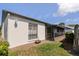 The backyard is well-maintained with green grass and a patio at 322 Windrush Loop # 22, Tarpon Springs, FL 34689