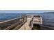 Wooden dock and pier with views of the water and horizon at 322 Windrush Loop # 22, Tarpon Springs, FL 34689