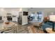 Inviting living space featuring a kitchen and living room area with an outdoor patio at 322 Windrush Loop # 22, Tarpon Springs, FL 34689