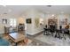 Spacious living area featuring vaulted ceilings, wood flooring, and plenty of natural light at 322 Windrush Loop # 22, Tarpon Springs, FL 34689