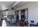 Covered patio features an outdoor dining table with seating with great views at 322 Windrush Loop # 22, Tarpon Springs, FL 34689