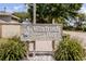 Windrush Bay community sign surrounded by lush landscaping at 322 Windrush Loop # 22, Tarpon Springs, FL 34689