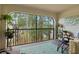 Spacious balcony offering serene views of the surrounding nature and partial lake view at 3399 Mermoor Dr # 301, Palm Harbor, FL 34685