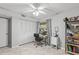 Spare bedroom with fan, view, large wardrobe, and adjustable desk for work or pleasure at 3399 Mermoor Dr # 301, Palm Harbor, FL 34685