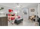 Bright bedroom with a red and white floral pattern bedspread and ample natural light at 3399 Mermoor Dr # 301, Palm Harbor, FL 34685