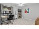 This spare bedroom has an expansive view, an adjustable desk, and a minimalist shelf at 3399 Mermoor Dr # 301, Palm Harbor, FL 34685