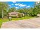 Community clubhouse with car wash area in paved parking lot at 3399 Mermoor Dr # 301, Palm Harbor, FL 34685
