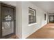 Inviting condo exterior hallway with a 'welcome' door decoration, offering a glimpse into the community's charm at 3399 Mermoor Dr # 301, Palm Harbor, FL 34685