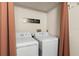 A small laundry room with a side-by-side washer and dryer that says 'Loads of Fun' at 3399 Mermoor Dr # 301, Palm Harbor, FL 34685